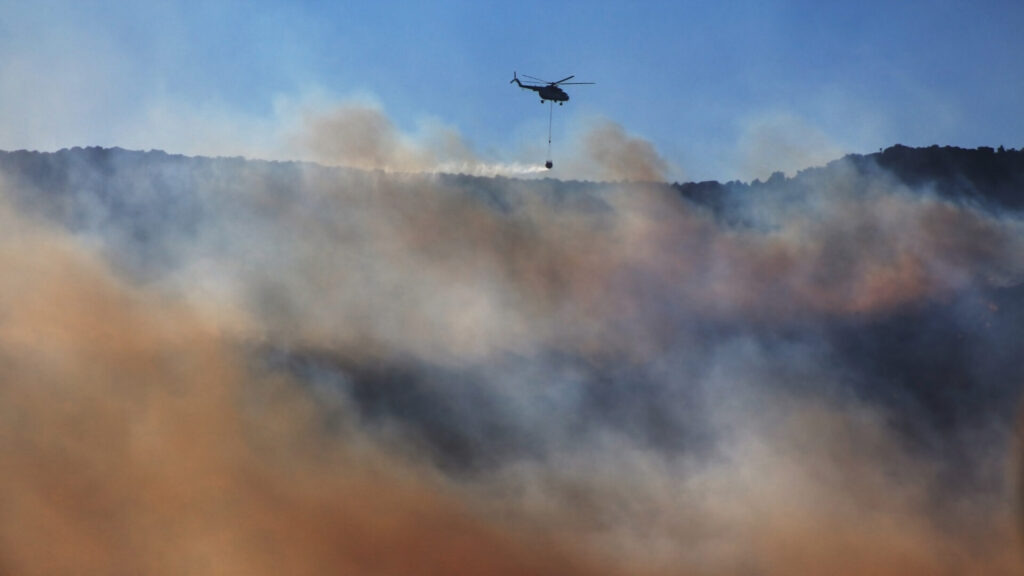 Aerial firefighting with helicopter during the Argentina wildfires