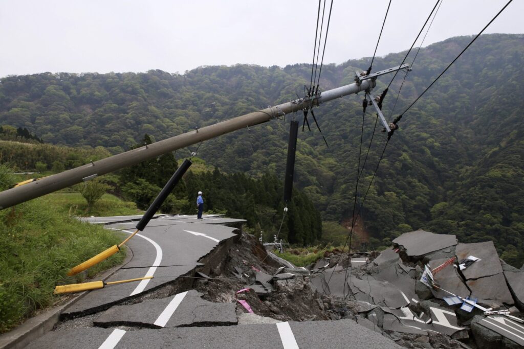 Damaged roads and powerlines from a significant earthquake.